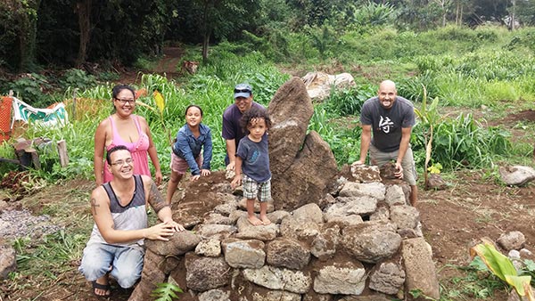Members of the Ku Pono club help build a Hawaiian garden located near Hale A‘o - Courtesy of Winston Kong