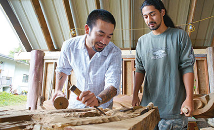 Jordan Souza shows a WCC student the finer art of wood carving – Bonnie Beatson