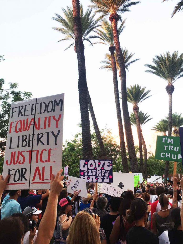 Anti-Trump protesters marched from Kapi‘olani Park to the International Trump Hotel in Waikiki chanting and holding signs – Courtesy of Austin Weihmiller
