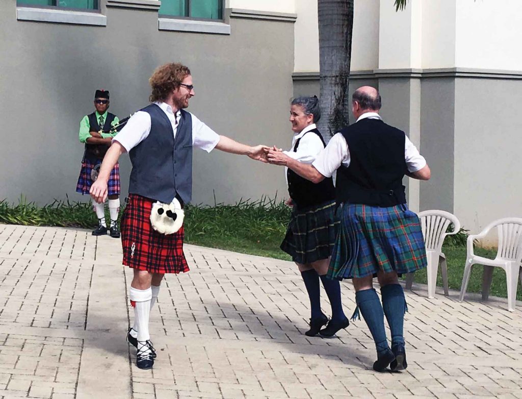 WCC IT specialist Michael McIntosh (left) participates in traditional Scottish dancing during IEW – Cynthia Lee Sinclair
